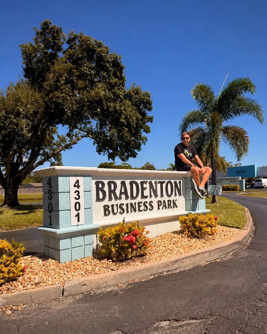 Ryan Davies at the Bradenton Business Park sign